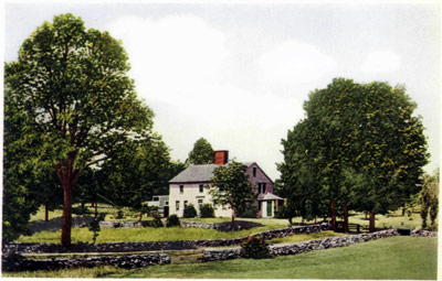 Whittier’s Birthplace A farmhouse set between the trees